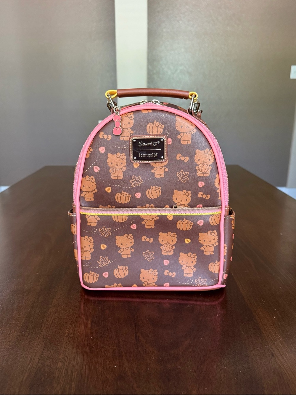 Loungefly Sanrio Hello Kitty Pumpkin Spice Allover Print Convertible Mini Backp
